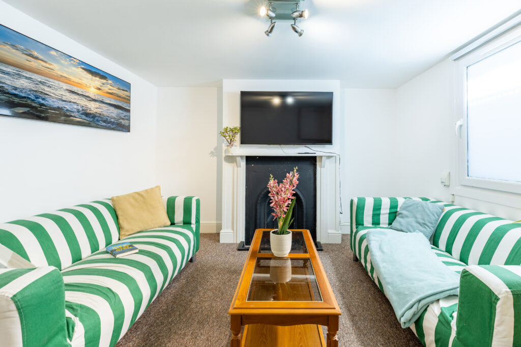 Spacious living room in one of our student houses in Cheltenham featuring comfortable seating