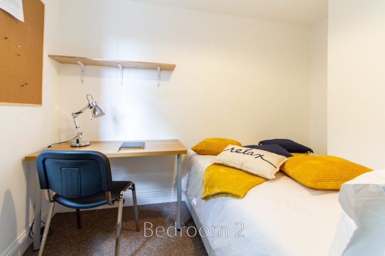 Bedroom 2 at 5 St Pauls Lane with study desk and comfortable bedding.