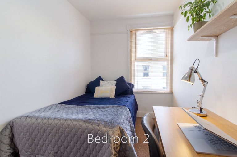 Room 2 at 5 St Pauls Street North featuring a desk and bed.