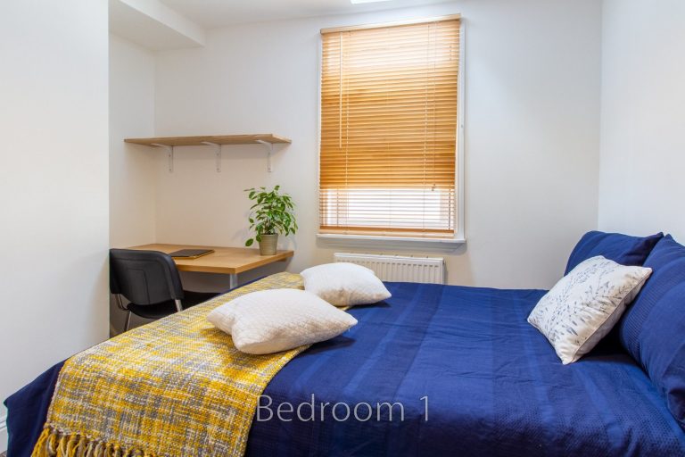 Bedroom 1 at 5 St Pauls Lane with natural light and cozy decor.