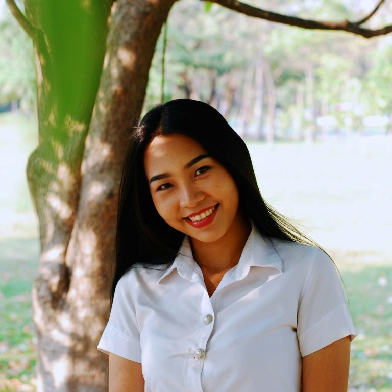 Molk, a student from 2023-24, smiling outdoors.