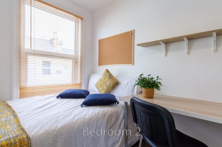 Bedroom 2 at 24 Granville Street with natural light and a desk area.